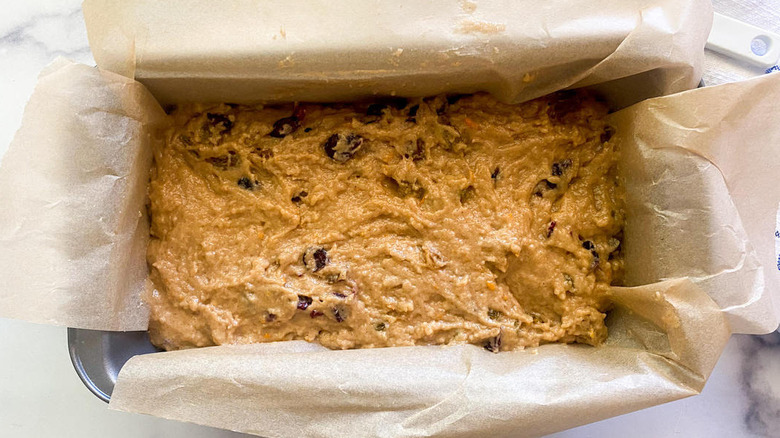 Bread batter sitting in a loaf pan