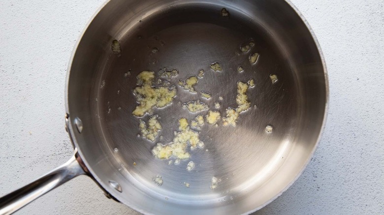 chopped garlic in frying pan