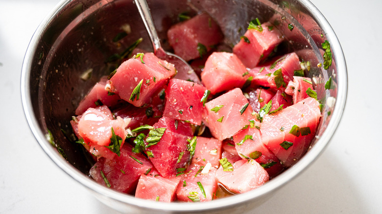 tuna cubes marinating in bowl