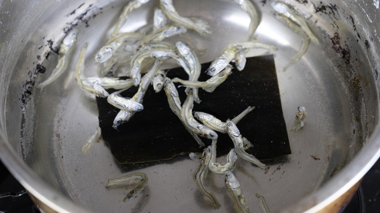 Dried anchovies floating in water