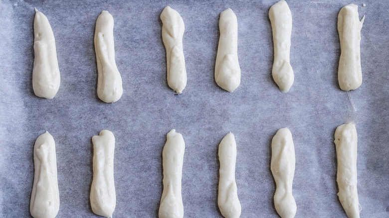 unbaked ladyfingers on pan