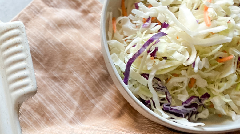 cabbage slaw in a white bowl