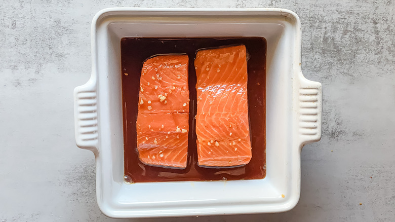 Salmon fillet marinading in honey soy mixture