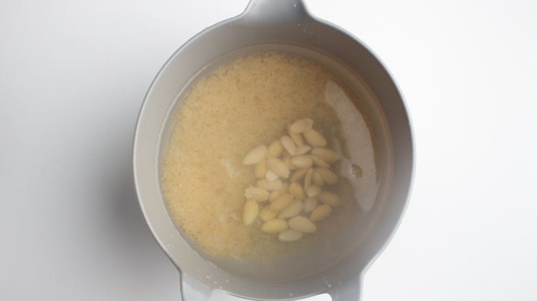 Pitcher with rice, almonds, and water