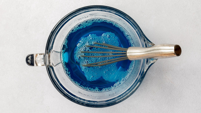 whisk and liquid blue Jell-O