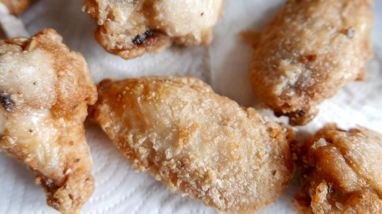 fried chicken wings on towel