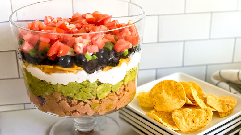 Easy Layered Taco Dip Recipe beans in bowl