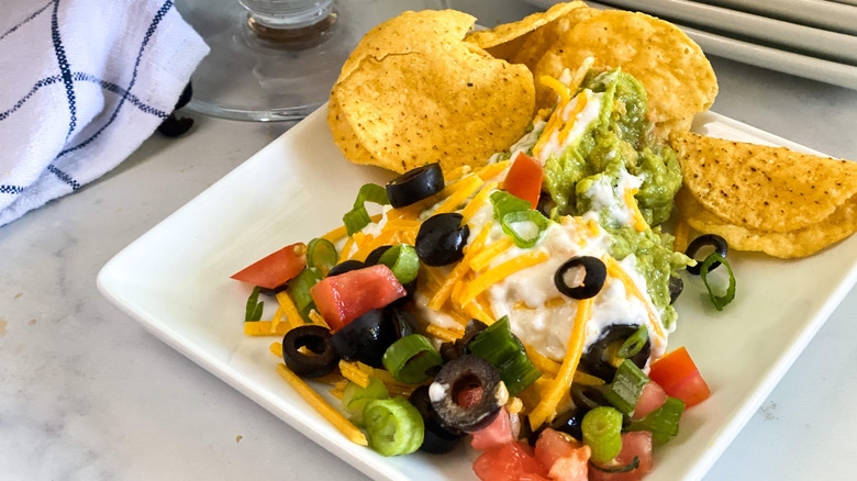 Easy Layered Taco Dip Recipe serving on plate