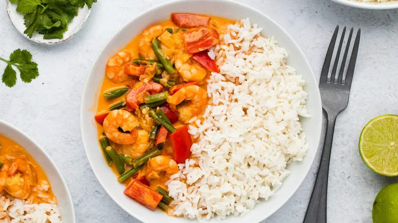 A bowl of shrimp Thai red curry with rice