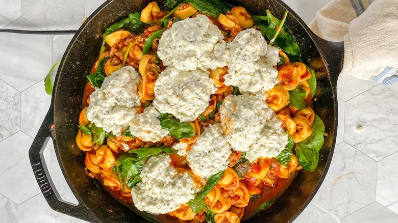 Tortellini and cheese in a skillet