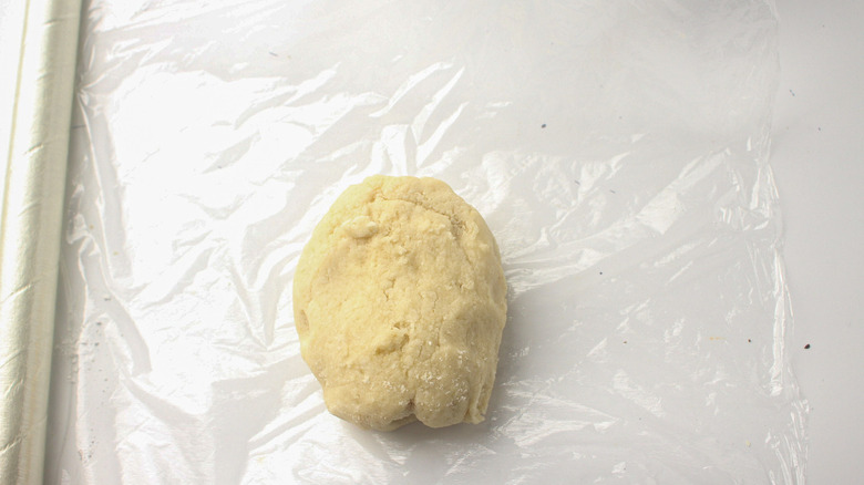 marzipan dough on plastic wrap