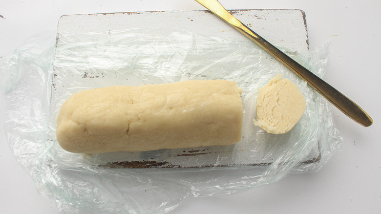 sliced marzipan log and knife