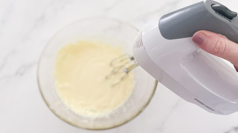 Mixing ingredients with a hand beater