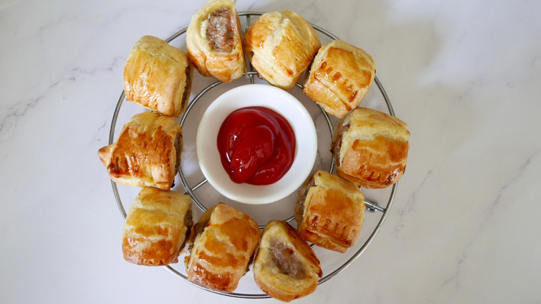 easy mini sausage rolls on rack