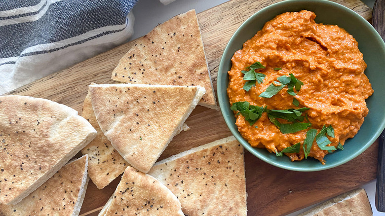 muhammara in bowl with pita 