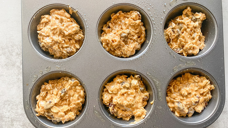 Oatmeal raisin muffins in a muffin tin