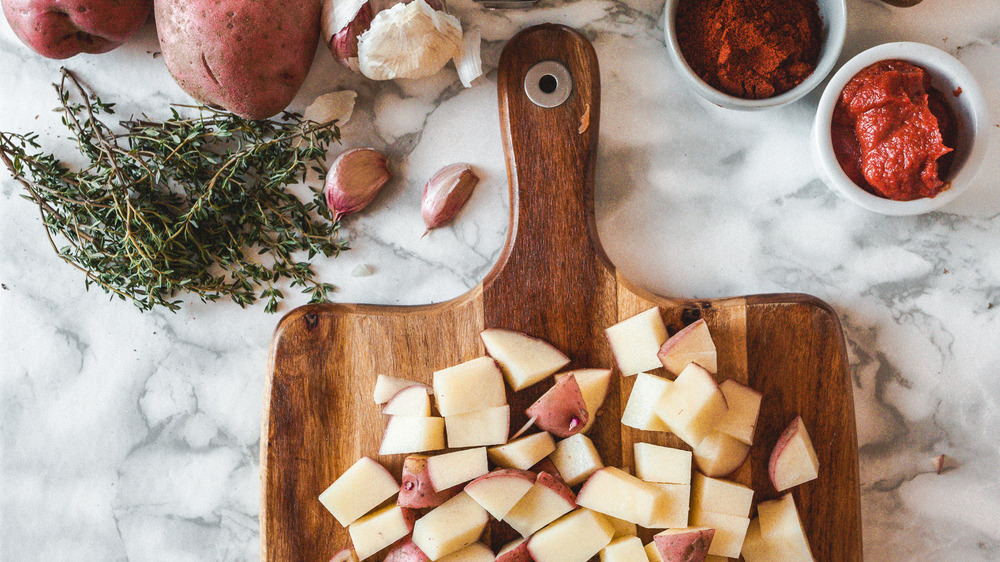 Chopped potatoes and other goulash ingredients