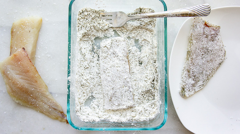 fish being dredged in flour