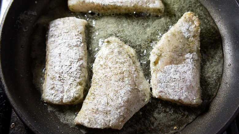 rockfish being crisped in oil