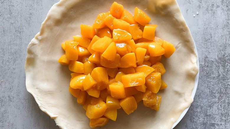 peach chunks on pie crust