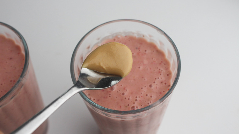 peanut butter spoonful over smoothie