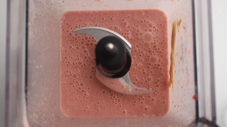 pink-colored smoothie in blender