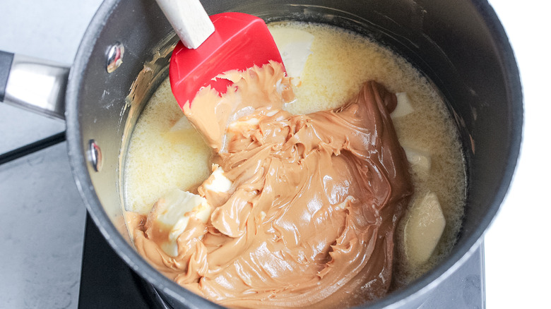 peanut butter and butter in saucepan 