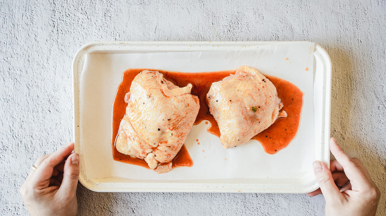 chicken thighs on baking sheet