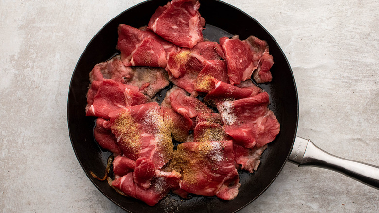 pan frying sliced steak