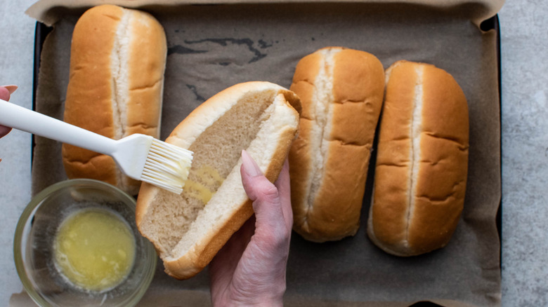 buttering hoagie rolls