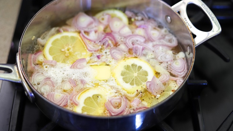 Simmering poaching broth