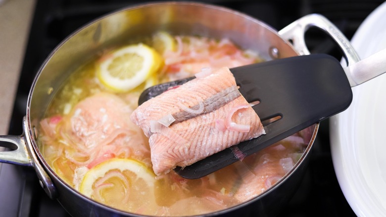 lifting poached salmon with spatula