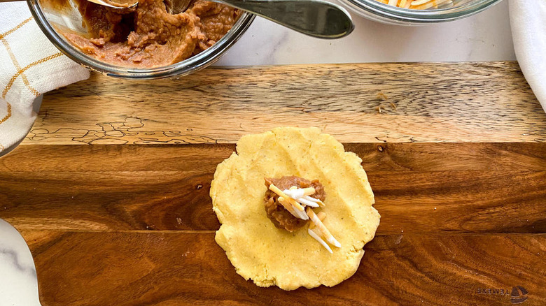 Masa on cutting board with fillings