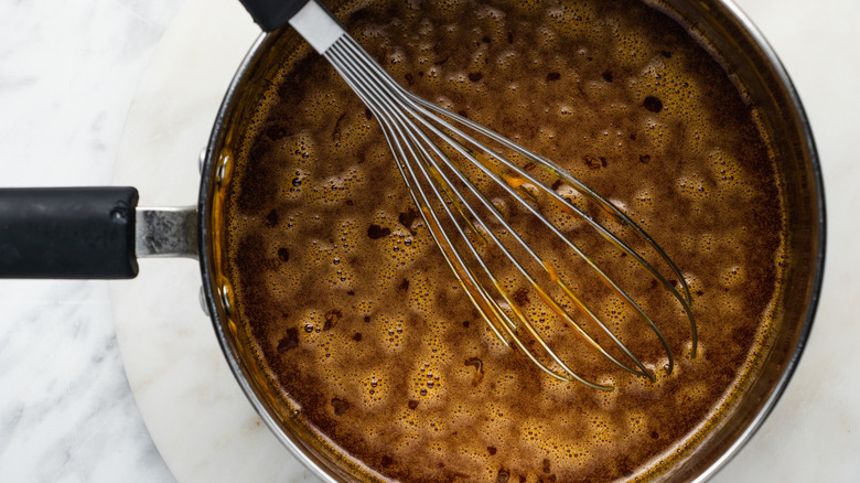 honey and sugar in saucepan