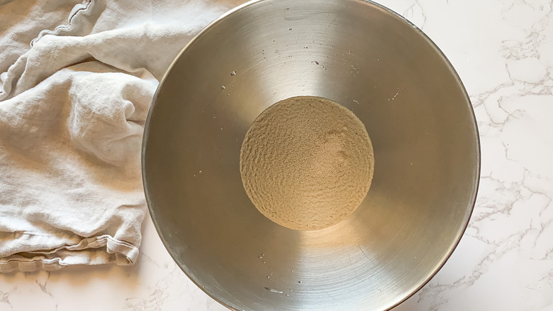 yeast, sugar, and water in bowl