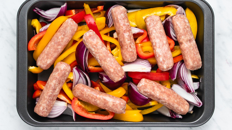 sausage and peppers on baking tray 