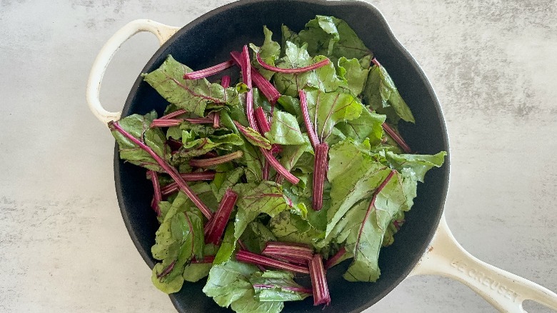 beet greens in pan