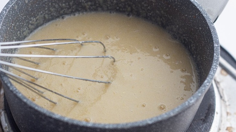 thickening semolina pudding in saucepan