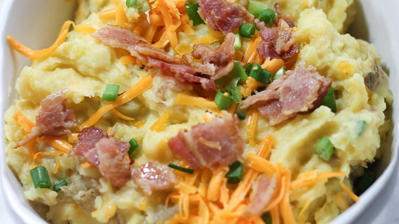 Instant Pot loaded mashed potatoes with bacon bits, onions, and cheese