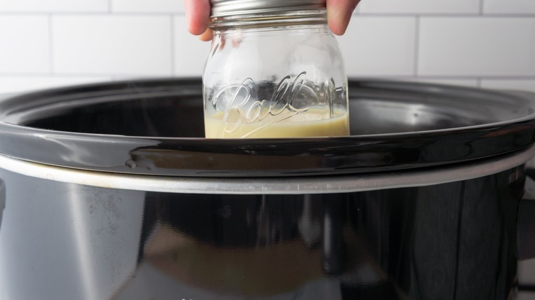 jar placed in slow cooker