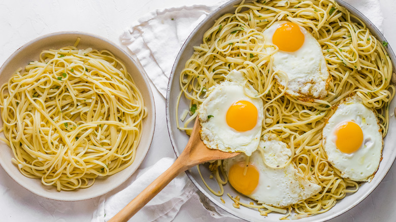 assembling pasta and egg dish