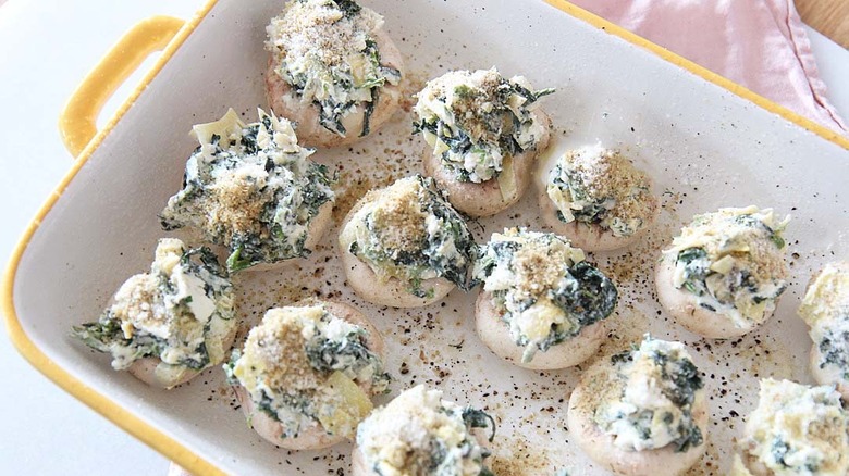 stuffed mushrooms in baking dish