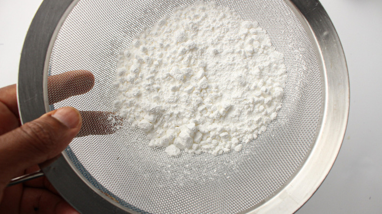 powdered sugar in sieve