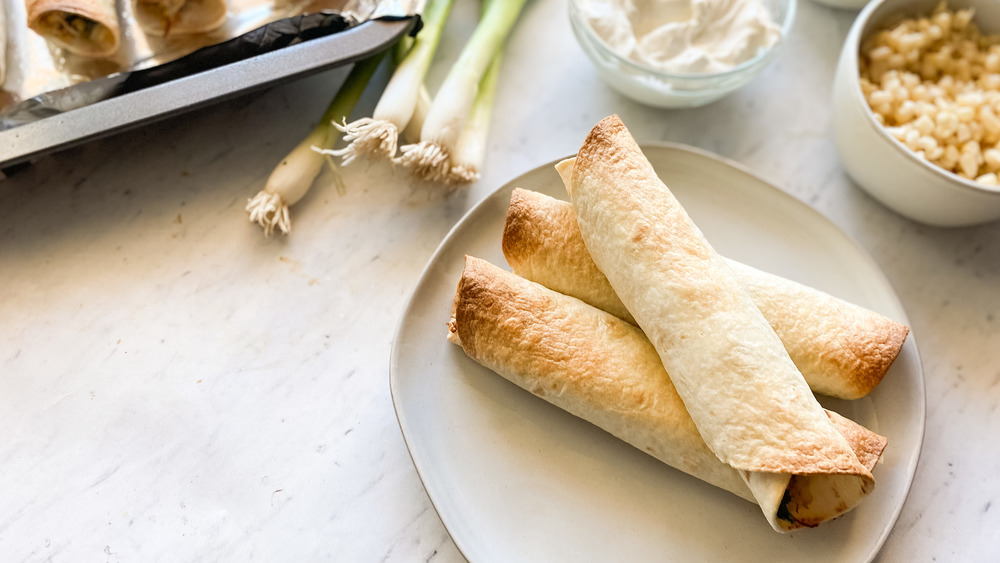 taquitos on white plate