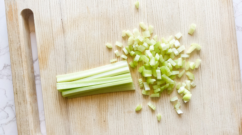 chopped celery on cutting board