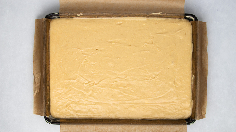 Yellow cake batter in pan