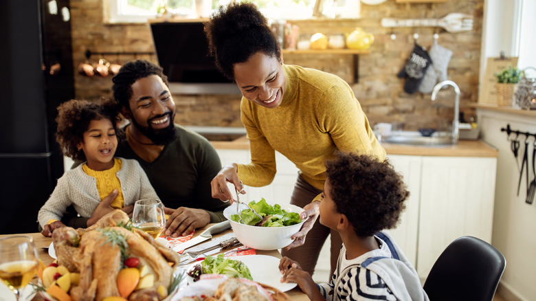 family of four eating together