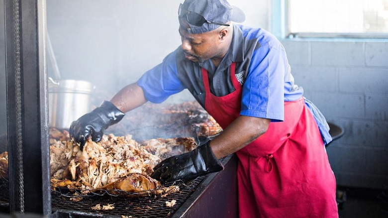 Rodney Scott over a barbecue grill