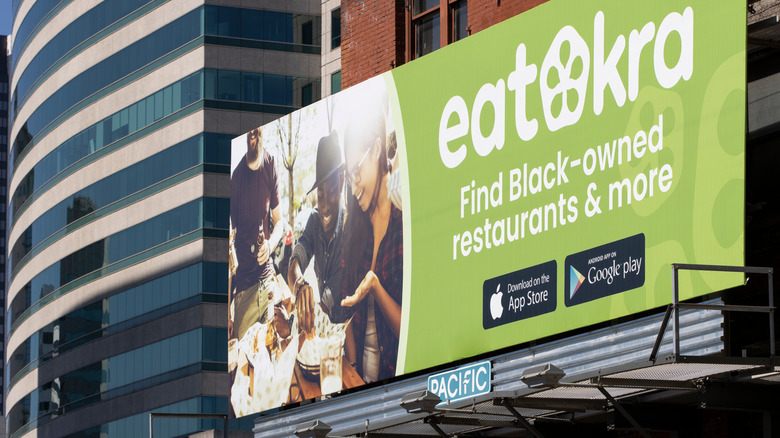 EatOkra billboard ad in front of several buildings