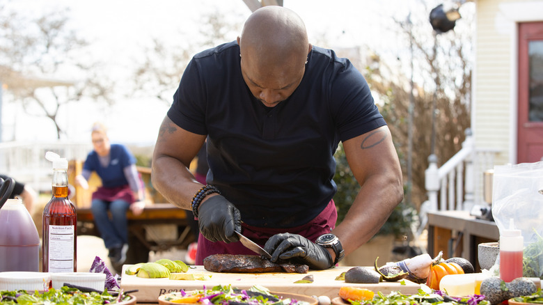 Eddie Jackson chopping up meat